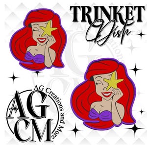 May include: Ariel-themed design featuring the Little Mermaid holding a yellow starfish over one eye. The design includes the text "TRINKET Dish" and the logo "AG Creations and More". The image has a white background with star accents.