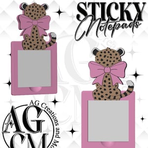 May include: Pink sticky notepads with a cheetah design. Each notepad features a cheetah with a pink bow. The text "STICKY Notepads" is displayed in black script. The logo "AG Creations and More" is also visible.