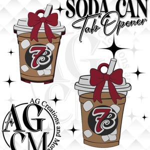 May include: A brown soda can tab opener shaped like a coffee drink with a red bow and straw. The opener has a white lid and ice cubes. The number 7 is in the center. The text "SODA CAN Tab Opener" is at the top.