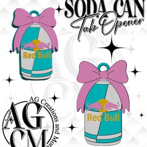 May include: Two soda can tab openers shaped like Red Bull cans with a pink bow on top. The cans feature a teal and silver colour scheme with a yellow circle and two pink bulls. The text SODA CAN Tab Opener is visible in black, along with the AG Creations and More logo.