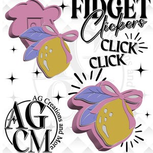 May include: A graphic design featuring the words "FIDGET Clickers" and "CLICK CLICK" in black. The design includes a lemon with a pink bow and purple leaves, and a pink flower shape. The logo "AG CM" is also present.