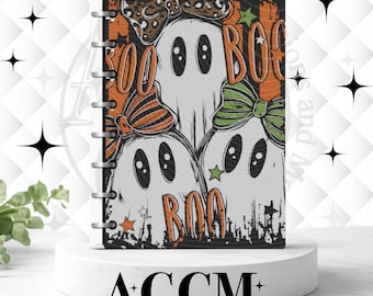 May include: A disc-bound notebook featuring a Halloween-themed cover with three white ghosts. The ghosts wear patterned bows in leopard print, orange stripes, and green stripes. The word BOO is printed in orange text, accompanied by small orange and green stars.