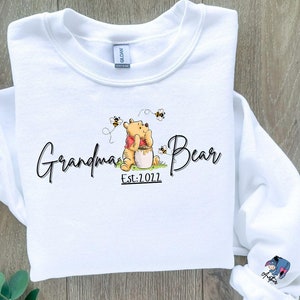 Custom Grandma Bear Hoodie and Sweatshirt, Mother Day Gift, Winnie the Pooh Mothers Days Gift, Mama Est with Kid Name on Sleeve Classic