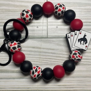 Pulsera con cuentas y clip para llavero