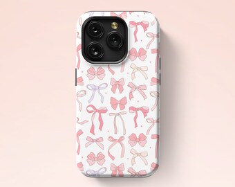 May include: A white phone case with a pattern of pink and purple bows. The case has a black camera lens cutout and the text "Pacific Melody Studios" is printed on the bottom.