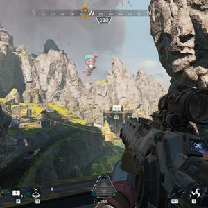 May include: A first-person view of a video game, showing a player aiming a gun with a scope at a distant target. The game's interface is visible, including the player's health, ammo count, and the number of squads remaining. The game is set in a mountainous landscape with a pink balloon floating in the sky.