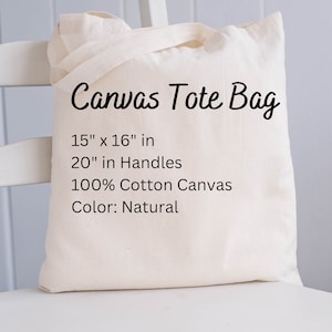 以下が含まれることがあります： ナチュラルカラーのキャンバス地のトートバッグ。黒い文字で「Canvas Tote Bag」、「15" x 16" in」、「20" in Handles」、「100% Cotton Canvas」、「Color: Natural」と書いてあります。