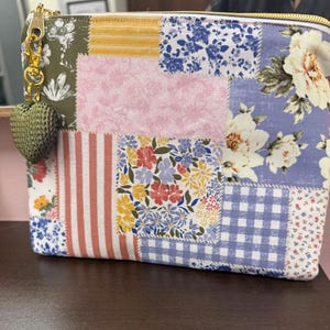 Patchwork makeup bag with heart zipper pull