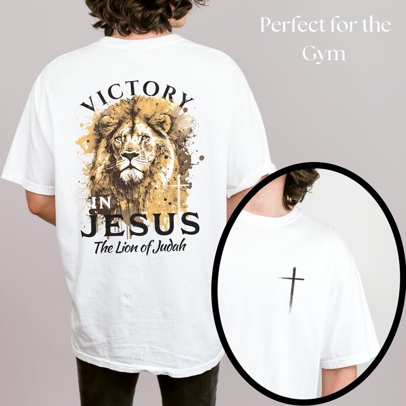 May include: White t-shirt with a lion graphic and the text "Victory in Jesus The Lion of Judah". The back of the shirt has a small cross graphic.
