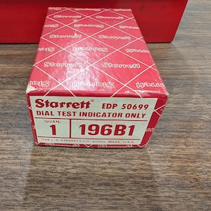 May include: A red and white Starrett box for a dial test indicator. The box has the Starrett logo repeated across the top. The front of the box has the text "DIAL TEST INDICATOR ONLY" and "1 196B1".