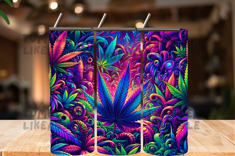 May include: Three colorful stainless steel tumblers with a psychedelic design featuring green, blue, and purple marijuana leaves and swirls.