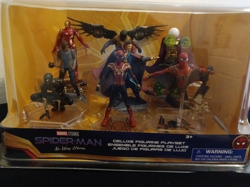 May include: A deluxe figurine playset featuring characters from the Marvel Studios movie Spider-Man: No Way Home. The set includes Spider-Man, Doctor Strange, Iron Man, and other characters. The figures are made of plastic and are approximately 3 inches tall.