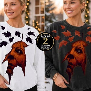 Puede incluir: Un paquete de dos sudaderas de cuello redondo, una blanca y otra gris carbón, cada una con un gráfico de un rostro de hoja naranja estilizado con ojos brillantes rodeado de hojas pequeñas y el texto Pack of 2 Exclusive Designs.