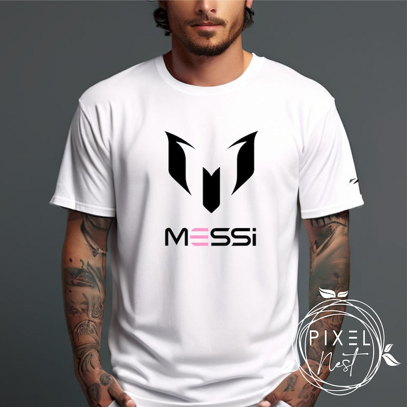 May include: White t-shirt with a black soccer logo and the word "MESSI" in pink letters.