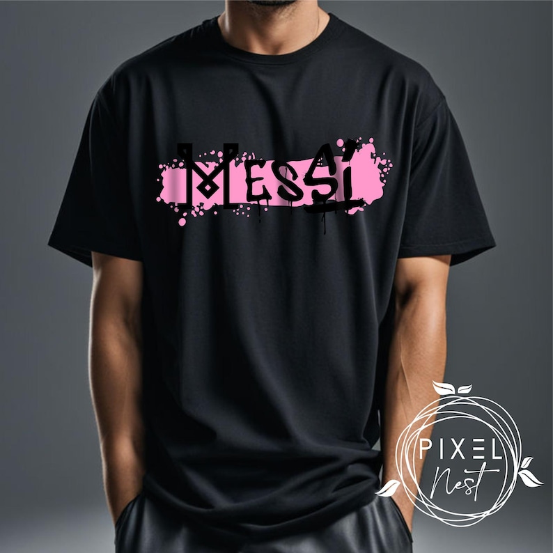 May include: Black t-shirt with a pink spray paint design that says "MESSI" in black letters.