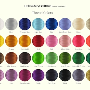 May include: A chart of 24 different embroidery thread colors, arranged in four rows of six colors each. The colors are labeled with their names, including white, silver, Prussian blue, light blue, blue, cornflower blue, linen, beige, yellow, orange, deep gold, red, pink, salmon pink, deep rose, vermilion, light brown, clay brown, dark brown, lime green, mint green, moss green, emerald green, teal green, light lilac, lilac, dark fuchsia, purple, dark gray, black, pewter, and brass.