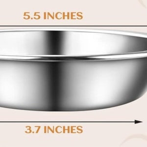 May include: A shiny stainless steel bowl. The bowl has a diameter of 14 cm, a width of 9.4 cm, and a depth of 3 cm. The rim is rolled. The bowl is suitable for food preparation or serving.