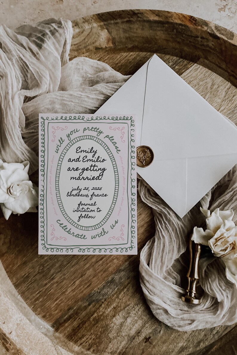 May include: A pink and green wedding invitation with a decorative border. The invitation reads "Will you pretty please... Emily and Emilio are getting married! July 25, 2025 Bordeaux, France Formal invitation to follow Celebrate with us"