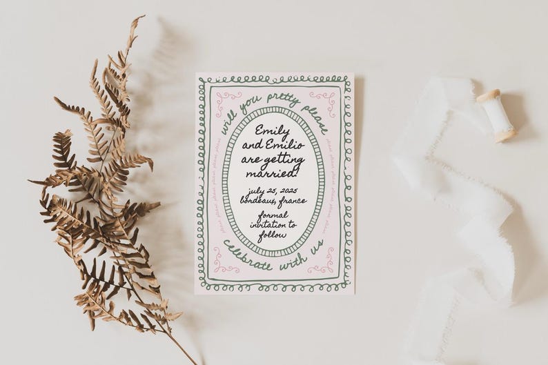 May include: A wedding announcement card with a pink and green border. The text reads "Will you pretty please... Emily and Emilio are getting married! July 25, 2025 Bondbaus, France Formal invitation to follow Celebrate with us"