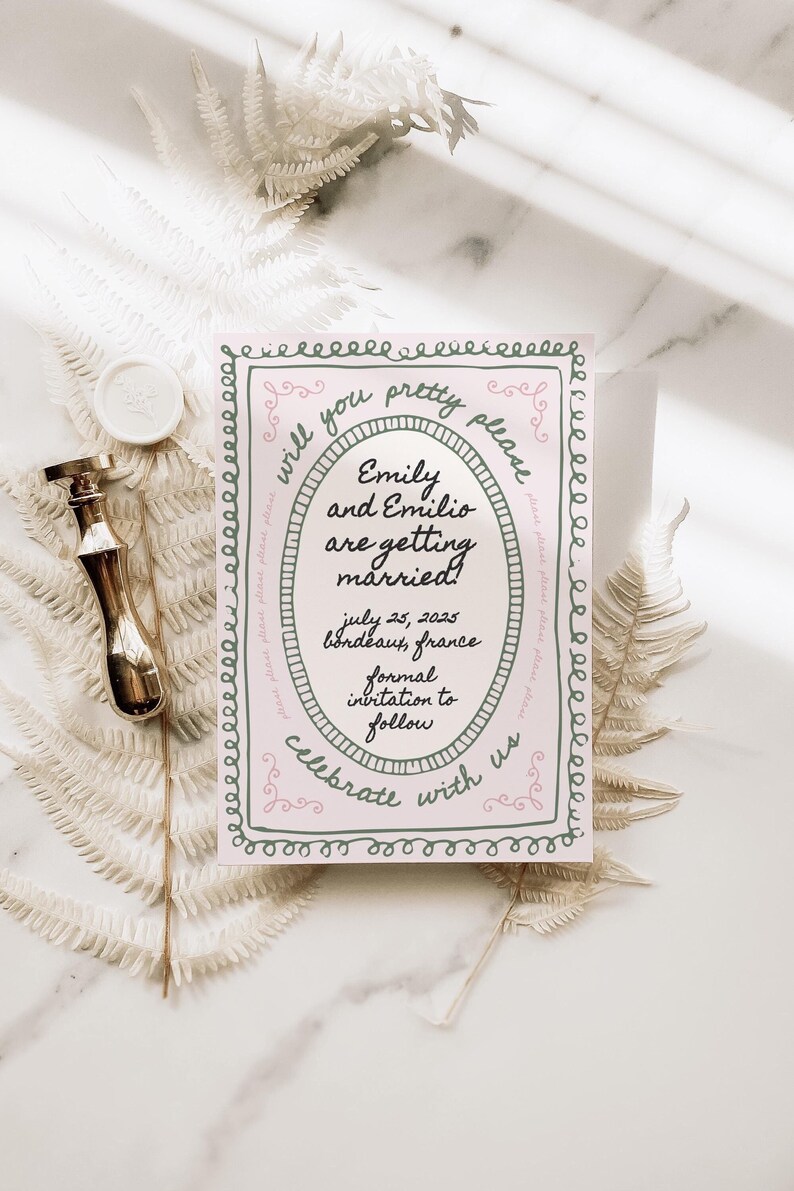 May include: A pink and green wedding invitation with a decorative border. The text reads "Will you pretty please... Emily and Emilio are getting married! July 25, 2023 Bordeaux, France Formal invitation to follow Celebrate with us"