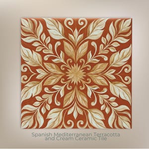 May include: Square terracotta ceramic tile with a cream-colored floral design. The design features stylized leaves and a central starburst pattern. The tile is labeled "Spanish Mediterranean Terracotta and Cream Ceramic Tile."
