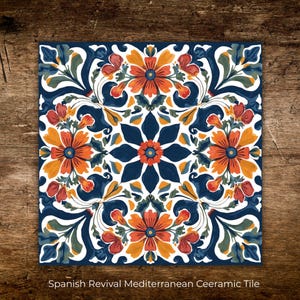 May include: Square ceramic tile with a floral design in orange, red, blue, and green. The tile features a symmetrical pattern of flowers and leaves against a white background. The text "Spanish Revival Mediterranean Ceramic Tile" is at the bottom.