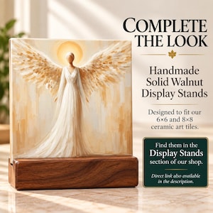 May include: A square ceramic art tile featuring an angel with large wings and a halo, set in a rectangular solid walnut display stand. Text reads: COMPLETE THE LOOK, Handmade Solid Walnut Display Stands, Designed to fit our 6x6 and 8x8 ceramic art tiles.