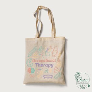 May include: Beige tote bag with the words "Occupational Therapy" and colorful illustrations of therapy-related objects. The bag has two handles and a simple design, perfect for carrying books, supplies, or personal items.
