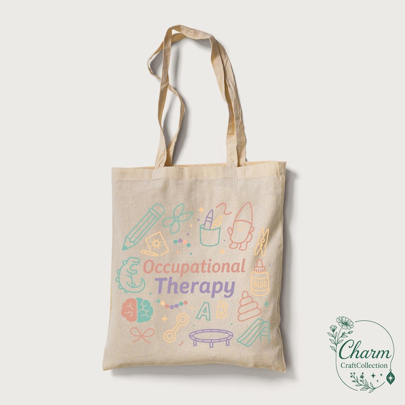 May include: Beige tote bag with the words "Occupational Therapy" and colorful illustrations of therapy-related objects. The bag has two handles and a simple design, perfect for carrying books, supplies, or personal items.