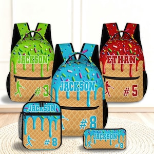 May include: Three backpacks, a lunch bag, and a pencil case featuring an ice cream cone pattern with melting frosting, colorful sprinkles, and baseball-themed graphics. The items are personalized with the names Jackson or Ethan and jersey numbers.