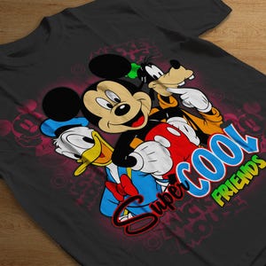 May include: Black t-shirt with a colorful graphic of Mickey Mouse, Donald Duck, and Goofy. The text "Super Cool Friends" is printed on the shirt.
