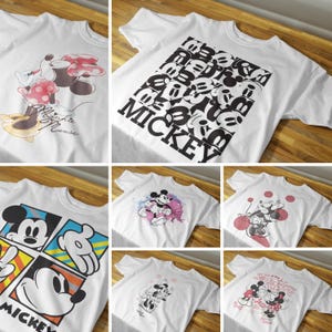 May include: A set of ten white t-shirts with different Mickey Mouse designs. The designs include Mickey Mouse with Minnie Mouse, Mickey Mouse with watercolor accents, and Mickey Mouse with text.