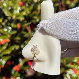 Butterfly nose ring piercing