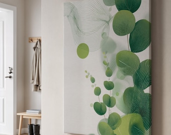 May include: A canvas wall art piece featuring a botanical design with green eucalyptus leaves and abstract lines. The artwork has a light background and is mounted on a wooden frame. The leaves vary in shades of green.