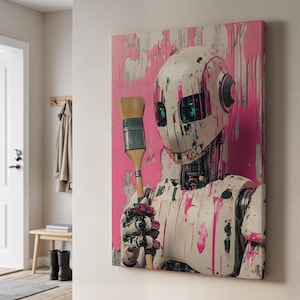 Może przedstawiać: Wydruk na płótnie przedstawiający robota trzymającego pędzel, pokrytego różową farbą na różowym tle. Robot ma metalową głowę z zielonymi oczami. Grafika jest zamontowana na ścianie, dodając nowoczesnego akcentu.