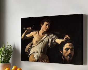 Puede incluir: Una pintura que representa a un joven sosteniendo una espada y una cabeza cortada. El hombre lleva una túnica blanca y tiene una barba marrón oscura. La cabeza también es la de un joven con una barba marrón oscura. El fondo es oscuro.