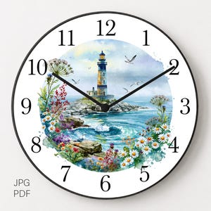 May include: A round wall clock with a black frame and white face featuring black numerals. The center displays a watercolor illustration of a lighthouse on a rocky coast surrounded by blue ocean waves, seagulls, and colorful wildflowers.