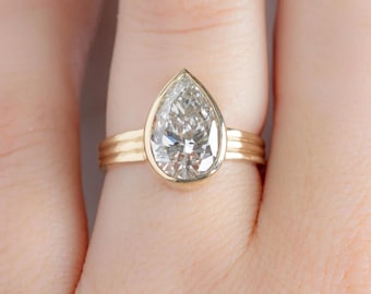 3 Carat Pear Lab Grown Diamond Ring: 14K Yellow Gold Bezel Solitaire