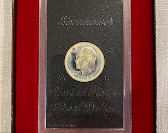 Eisenhower 1974 proof coin uncirculated in unopened government lens and brown box. Ike Dollar collector edition.
