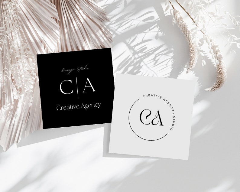 May include: Two business cards with a minimalist design. The first card is black with white text that reads "Design Studio CA Creative Agency". The second card is white with a black circle containing the letters "CA" and the text "Creative Agency Studio".