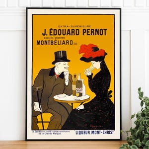 Puede incluir: Anuncio vintage para el licor J. Edouard Pernot Mont-Christ. El anuncio presenta a un hombre y una mujer en un ambiente de café, disfrutando del licor. El texto dice "Extra-Superieure J. Edouard Pernot Societe Anonyme Montbeliard" y "Liqueur Mont-Christ".