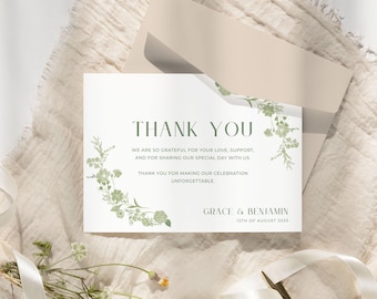 May include: A white thank you card with green floral accents and a matching envelope. The card reads "THANK YOU" and includes a message of gratitude, along with the names "GRACE & BENJAMIN" and the date "12TH OF AUGUST 2025".