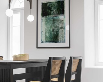 May include: Two black dining chairs with woven cane seats and backs, placed in front of a black dining table. A framed abstract painting with green and blue hues hangs on the wall behind the table.