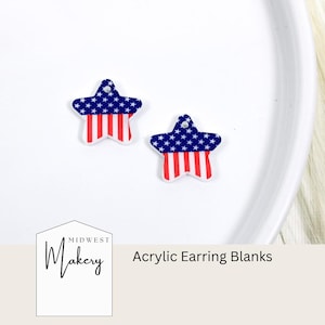May include: Two acrylic star-shaped earring blanks with a red, white, and blue American flag design. The blanks are on a white surface.  Midwest Makery Acrylic Earring Blanks.