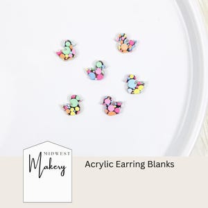 May include: Six colorful acrylic earring blanks shaped like ducks with a confetti pattern. The blanks are on a white surface. The text "Midwest Makery" and "Acrylic Earring Blanks" are visible below the blanks.