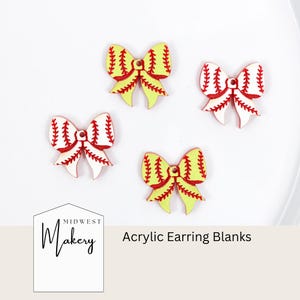 May include: Four acrylic earring blanks shaped like bows. Two are yellow with red stitching, and two are white with red stitching. The text "Acrylic Earring Blanks" is below the bows. The Midwest Makery logo is in the lower left corner.