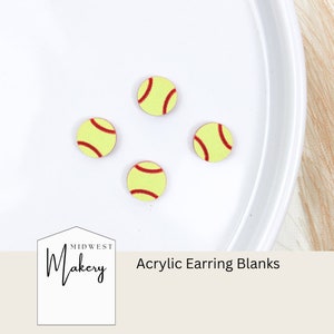 May include: Four yellow and red softball-themed acrylic earring blanks on a white surface. The text "Midwest Makery Acrylic Earring Blanks" is below the blanks.