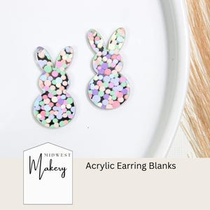 May include: Two pastel pink, green, and purple bunny shaped acrylic earring blanks with a confetti pattern.  Midwest Makery Acrylic Earring Blanks.