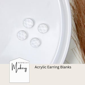 May include: Four white acrylic earring blanks with a textured surface. The blanks are arranged in a circle on a white plate. The text "Midwest Makery" and "Acrylic Earring Blanks" are visible in the image.
