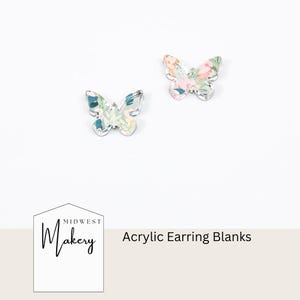 May include: Two acrylic butterfly earring blanks. The butterflies have a clear outline and are filled with a floral pattern in shades of pink, green, and blue. The text "Acrylic Earring Blanks" is displayed.